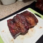 Cooked brisket on cutting board