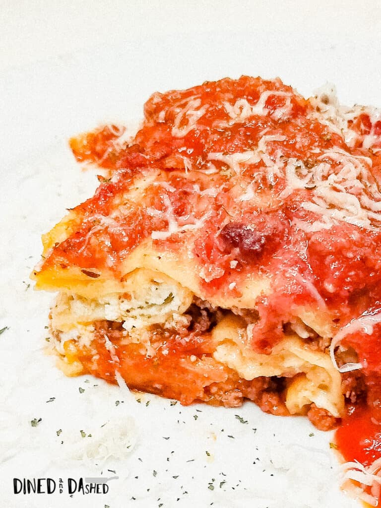 slice of layered lasagna recipe on a white plate